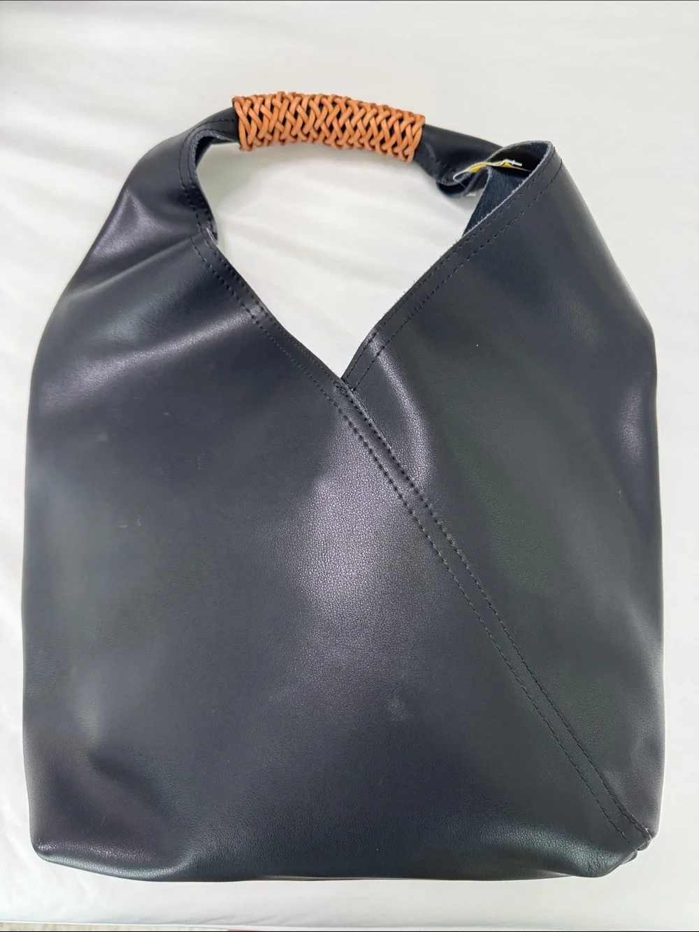Sleek Black Leather Hobo Bag with Woven Tan Handle